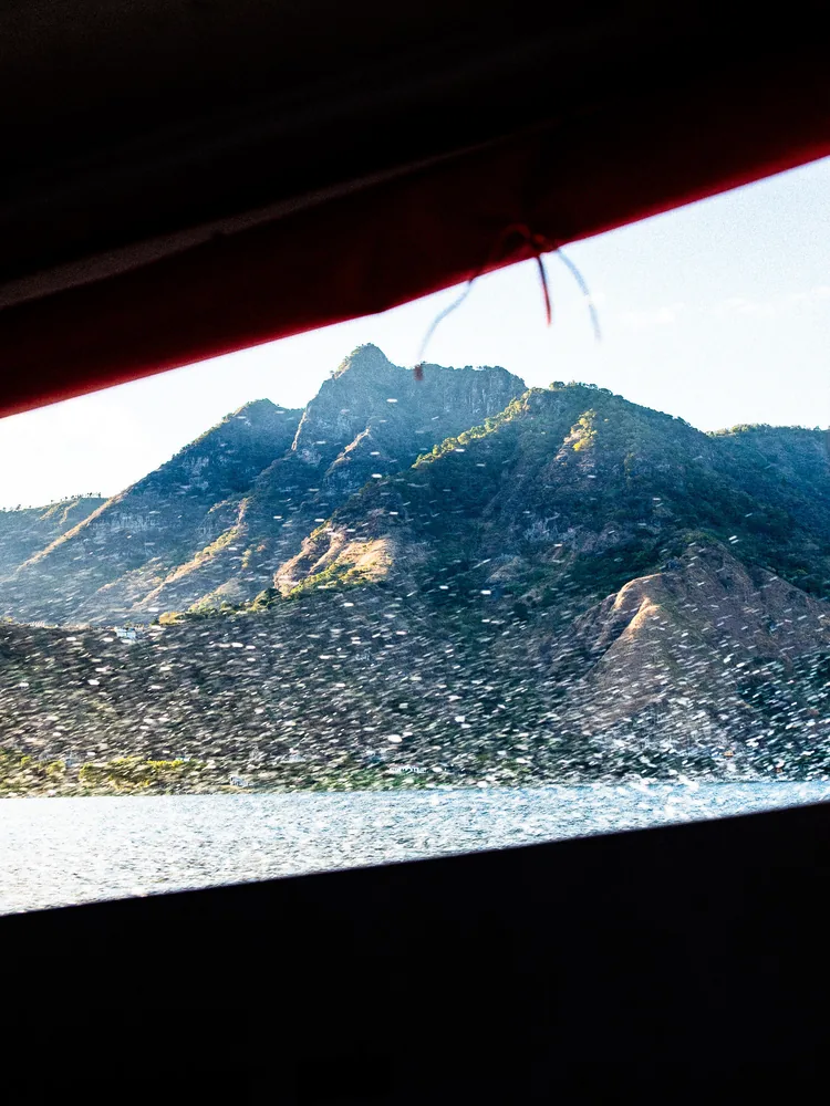 A volcano seen from a boat on Lake Atitlán, Guatemala